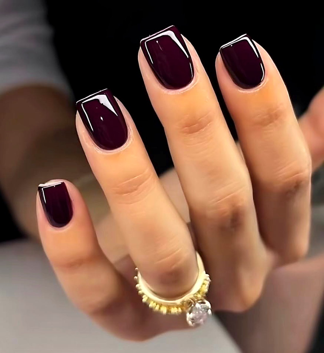 Glossy deep burgundy manicure at Coastal Polish & Beauty