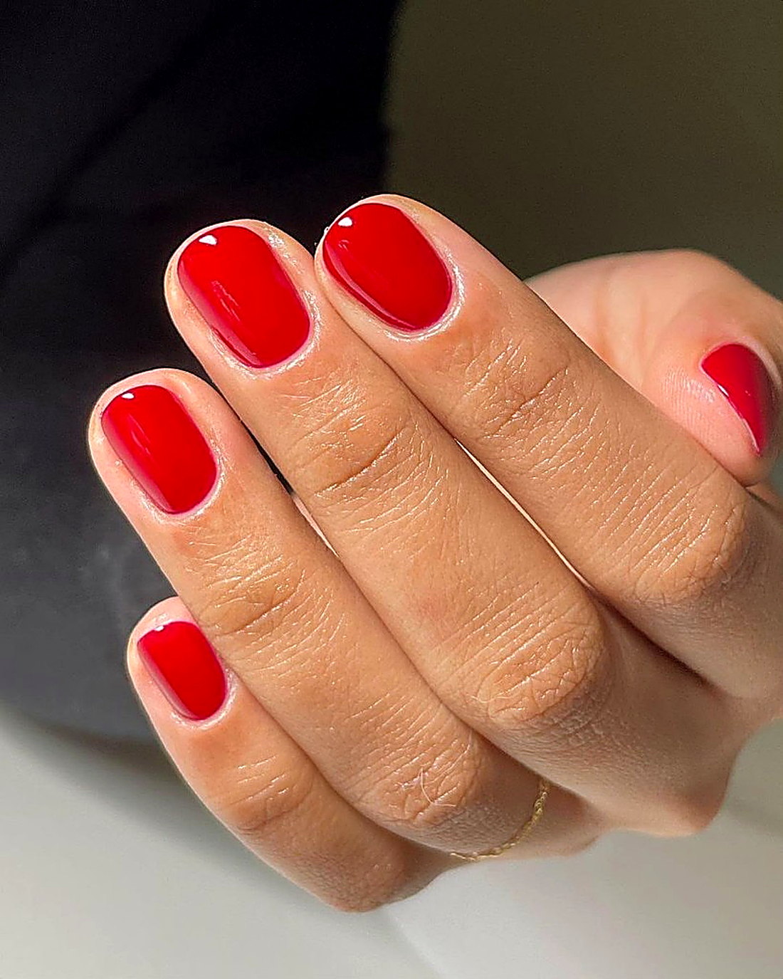 Classic red manicure finish at Coastal Polish & Beauty in Newport Beach
